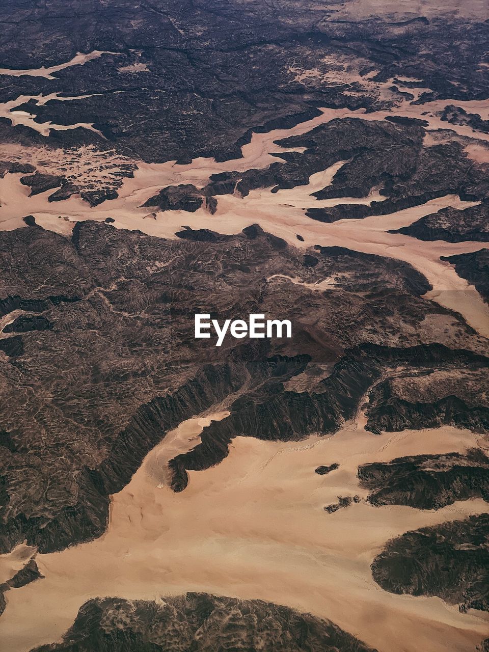 Dry riverbeds, canyons and desert in saudi arabia taken from an aircraft.