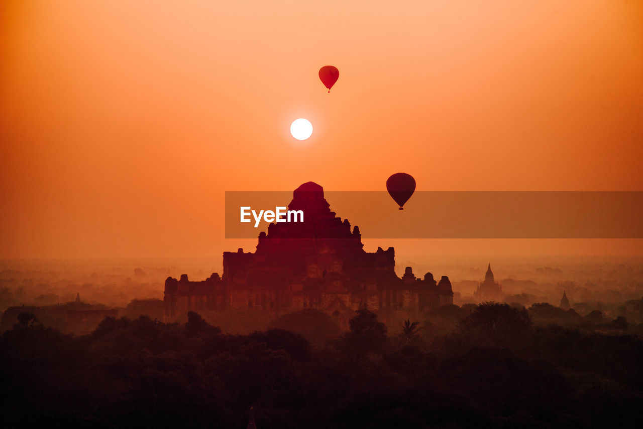 HOT AIR BALLOON AGAINST SKY DURING SUNSET