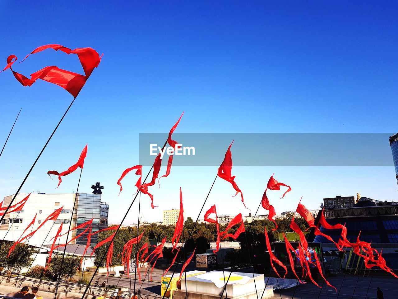 LOW ANGLE VIEW OF FLAG AGAINST BLUE SKY