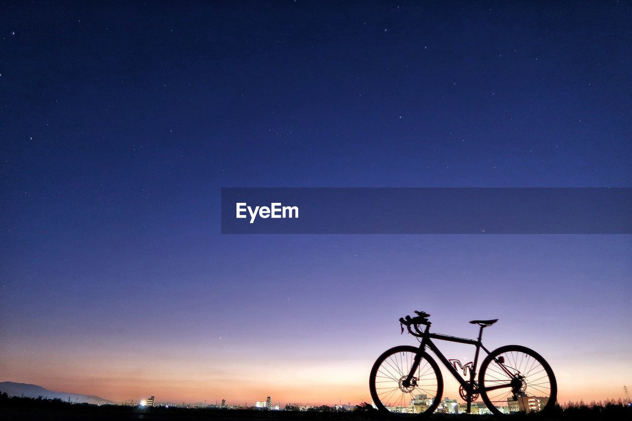 BICYCLE AGAINST BLUE SKY