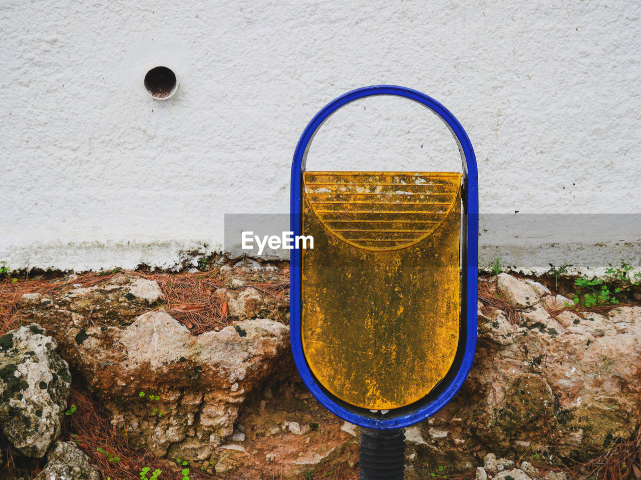 Close-up of rusty metal against wall