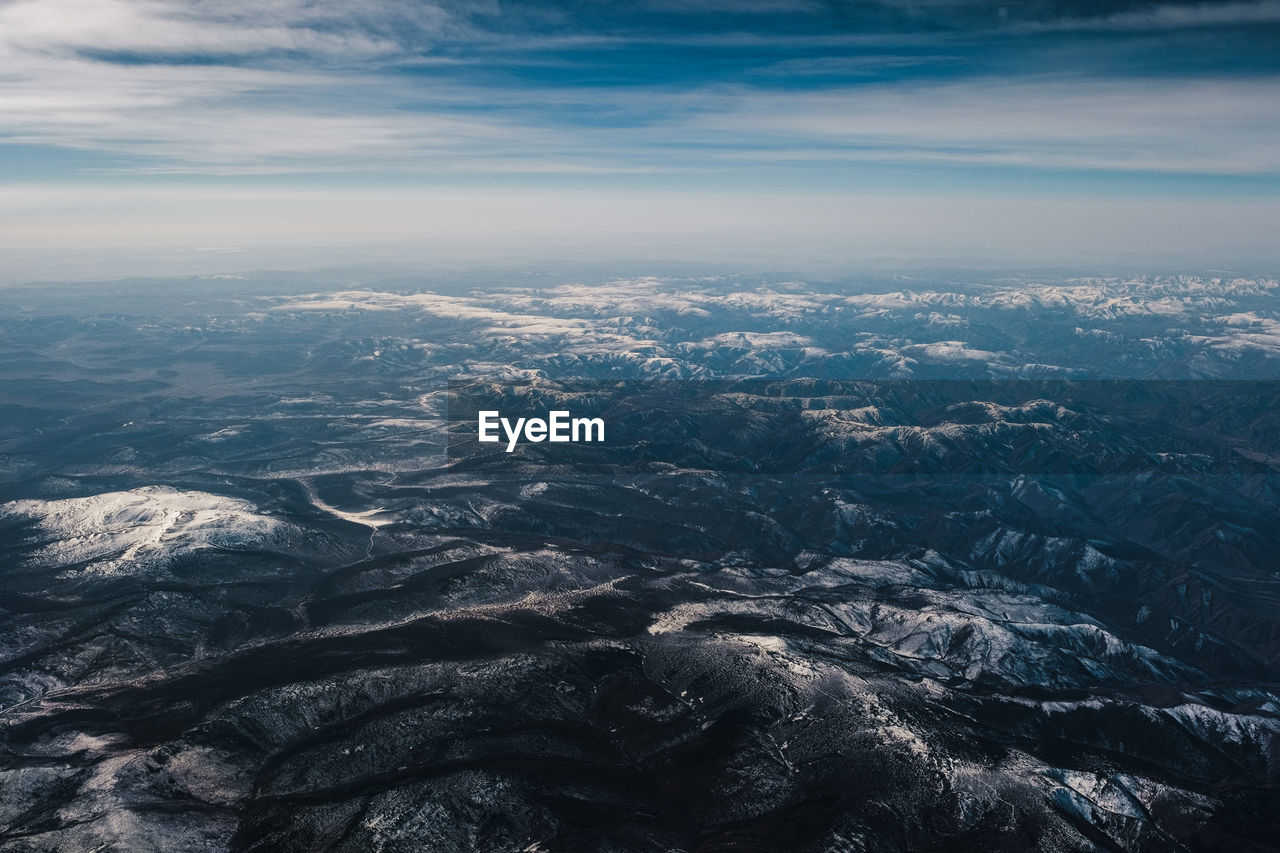 Aerial view of dramatic landscape against sky