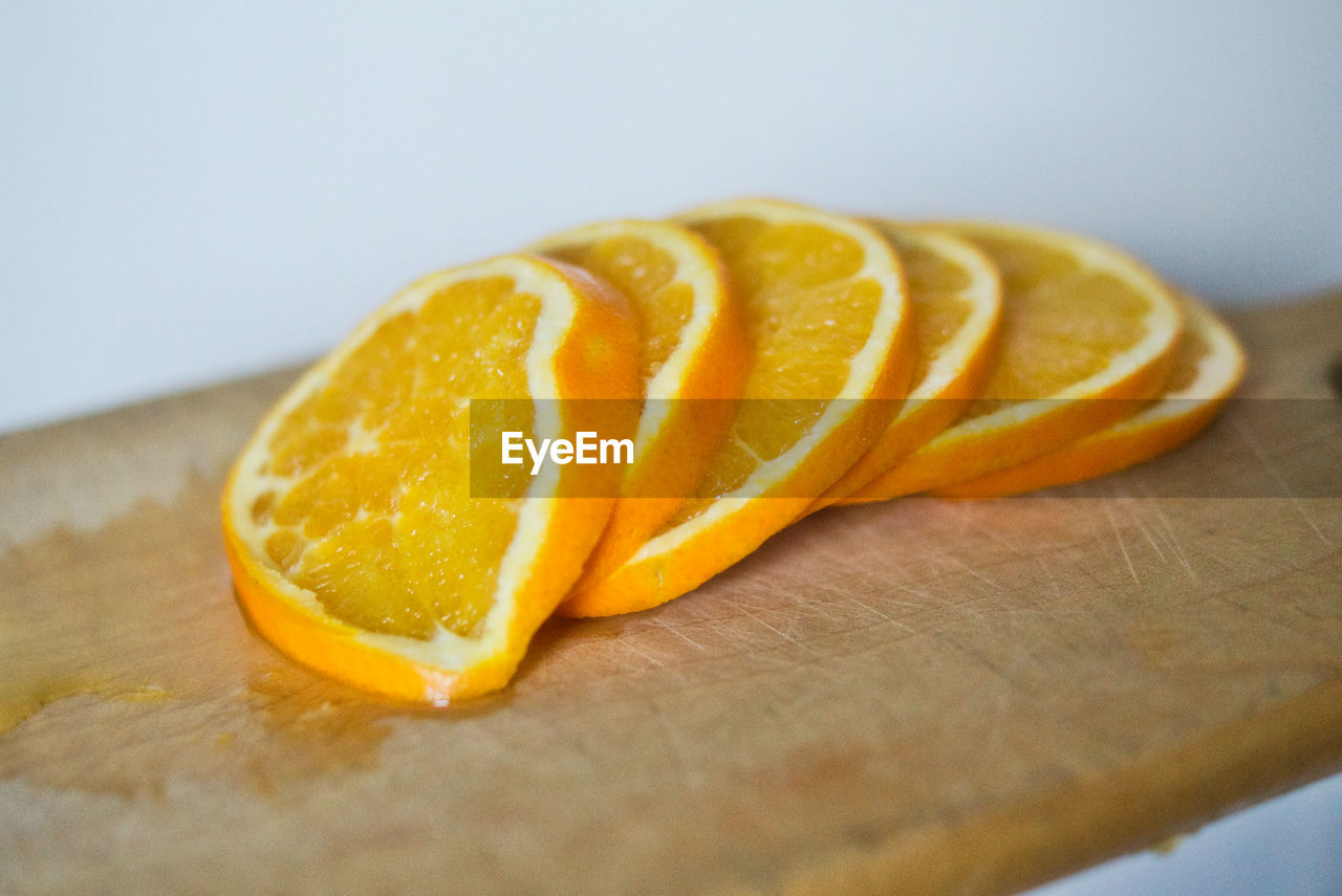 Close-up of orange slice on cutting board