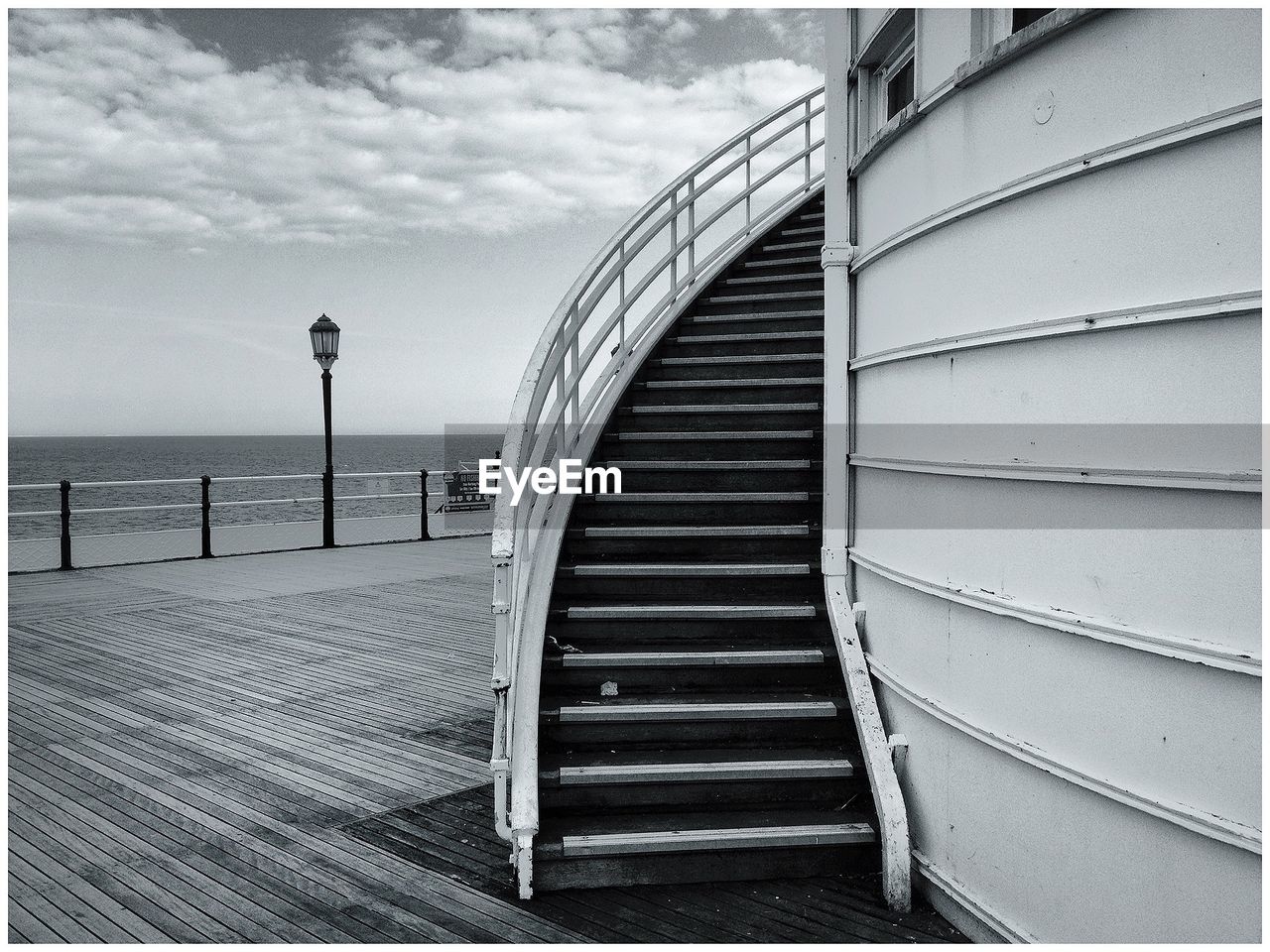 STEPS IN SEA AGAINST CLOUDY SKY