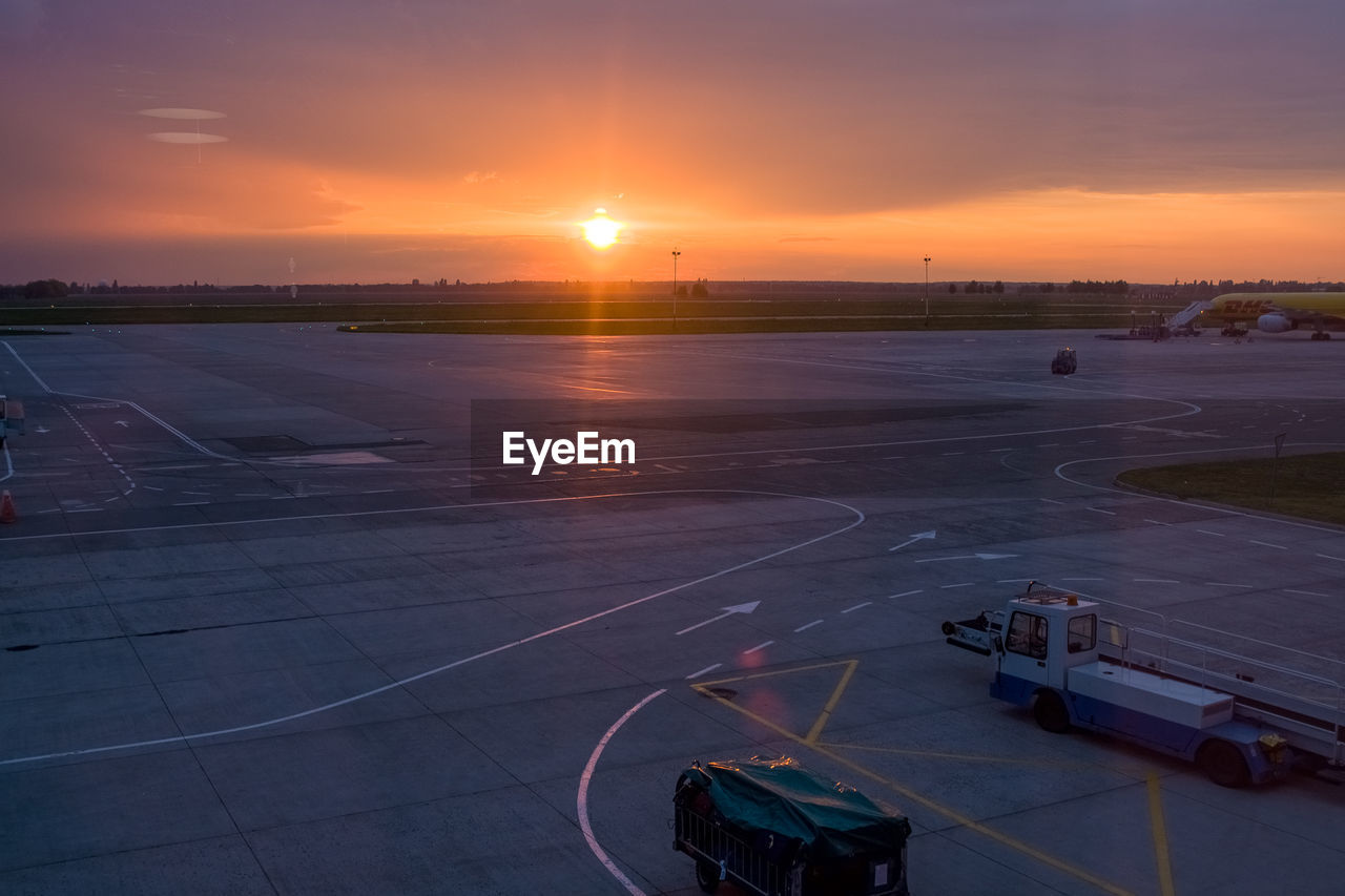 HIGH ANGLE VIEW OF AIRPORT DURING SUNSET