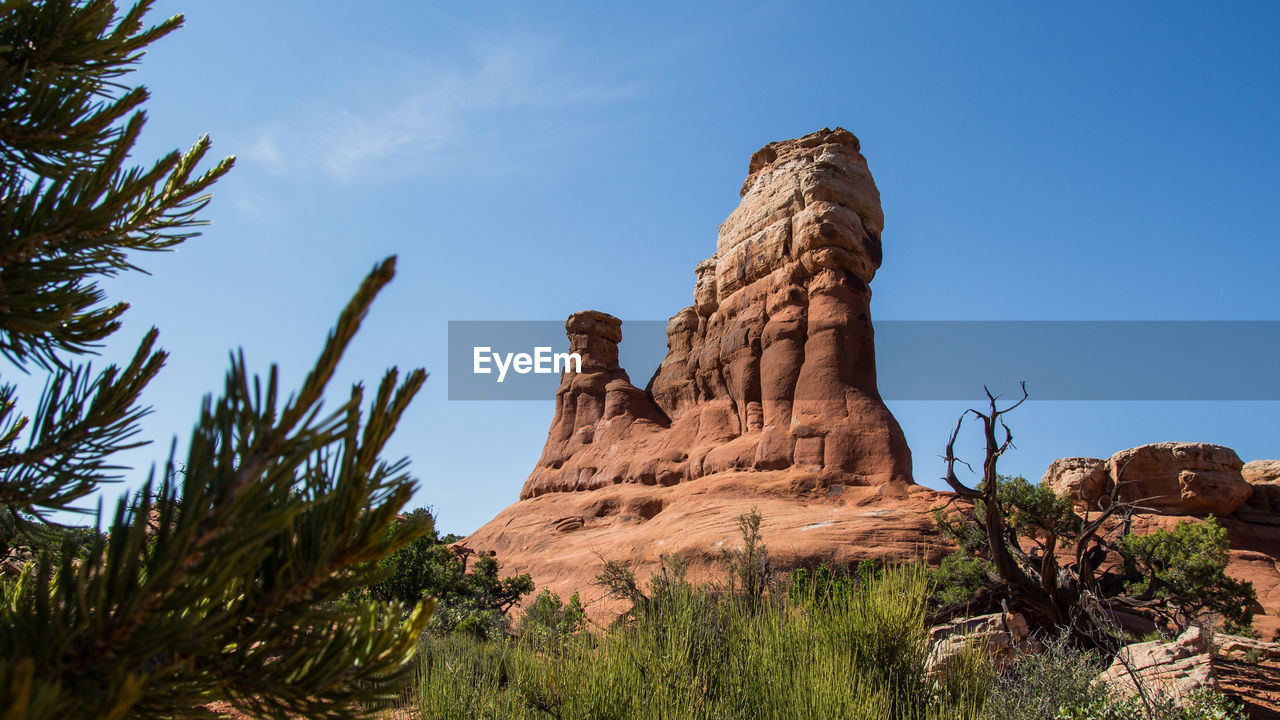 LOW ANGLE VIEW OF ROCK FORMATIONS