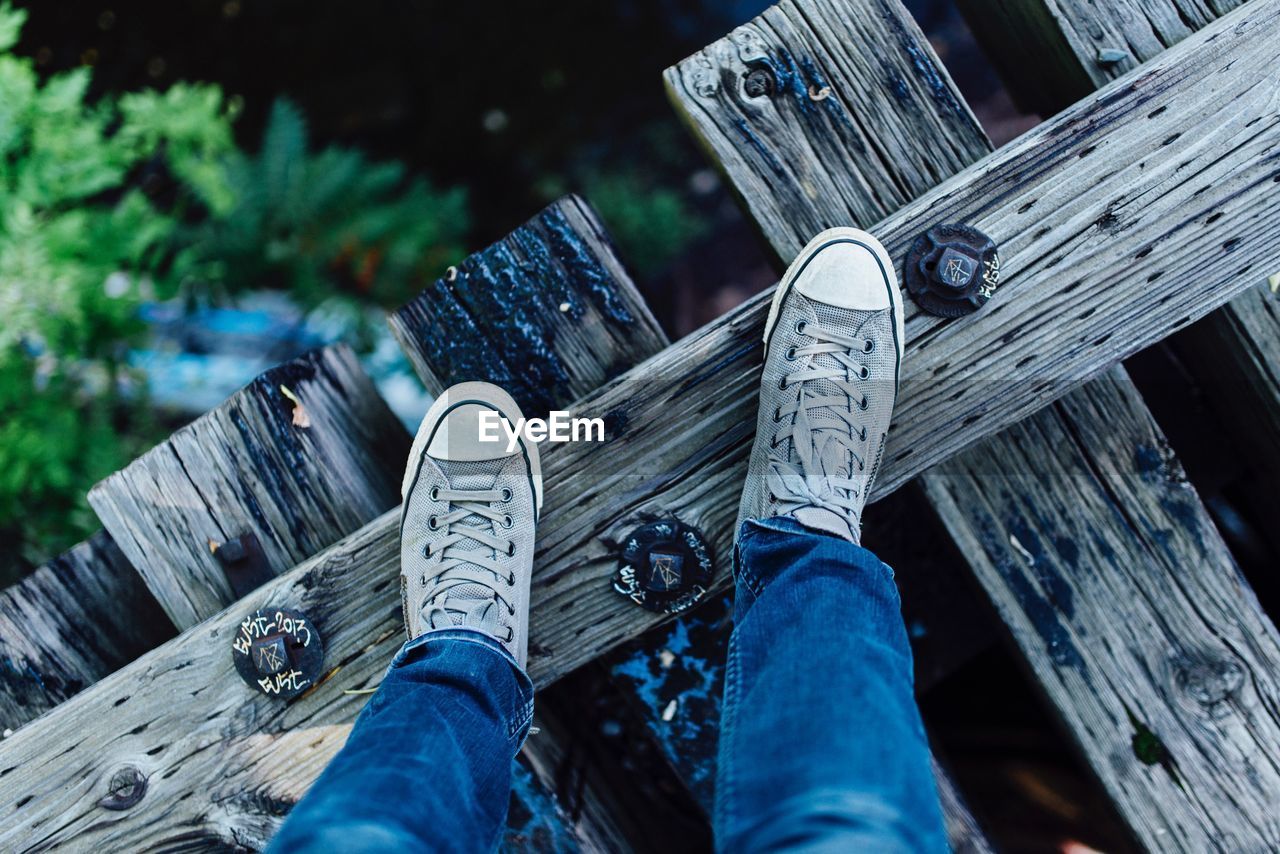 Person standing on wooden planks