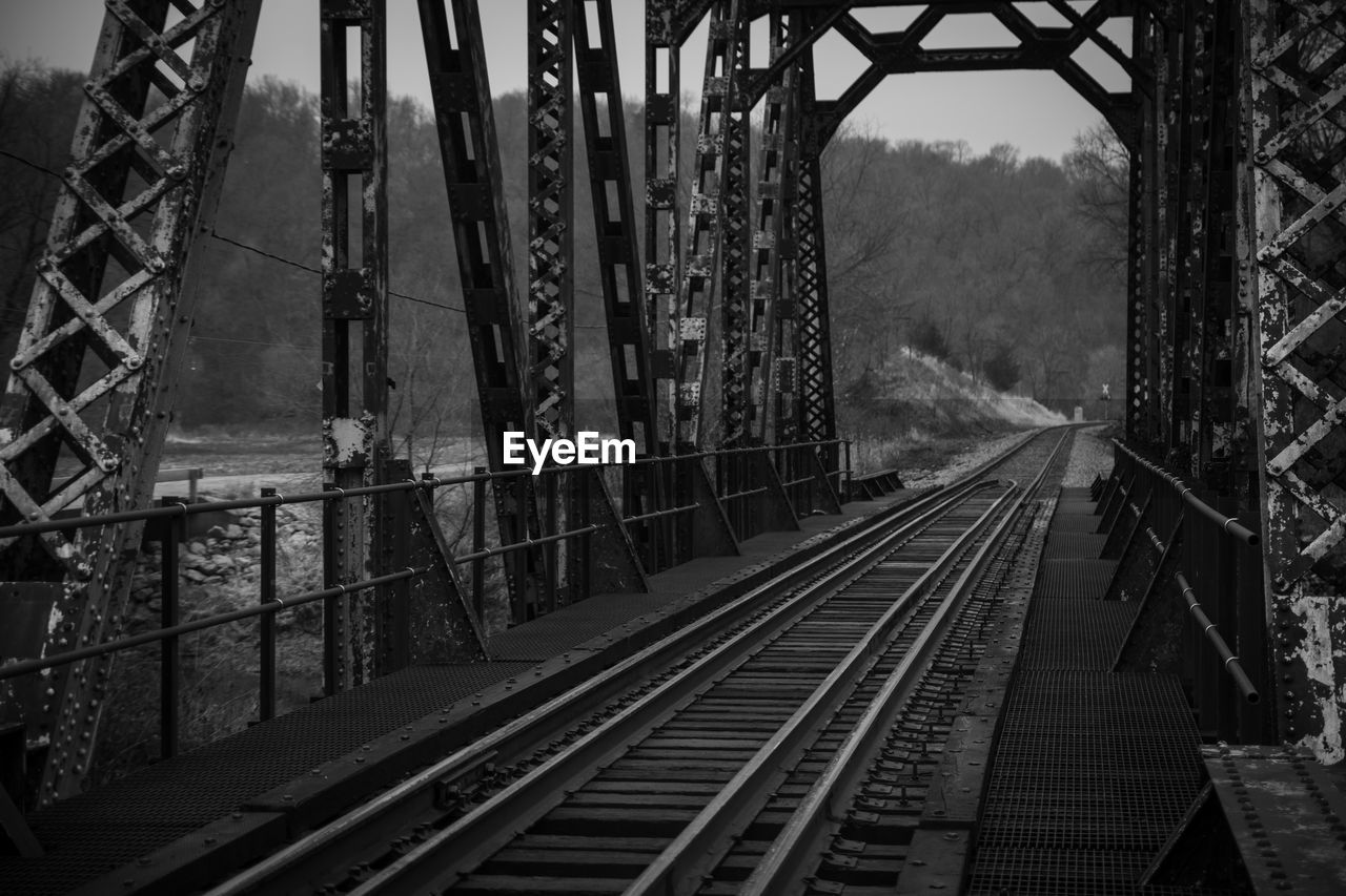 Railroad tracks along bridge