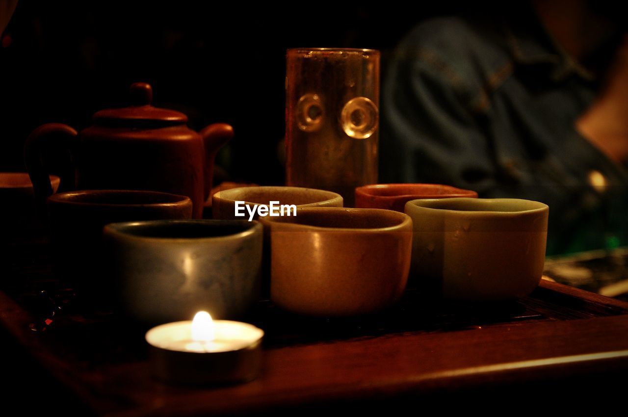 Close-up of tea light candles on table