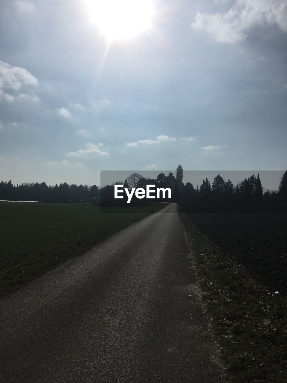 EMPTY ROAD AMIDST LANDSCAPE AGAINST SKY