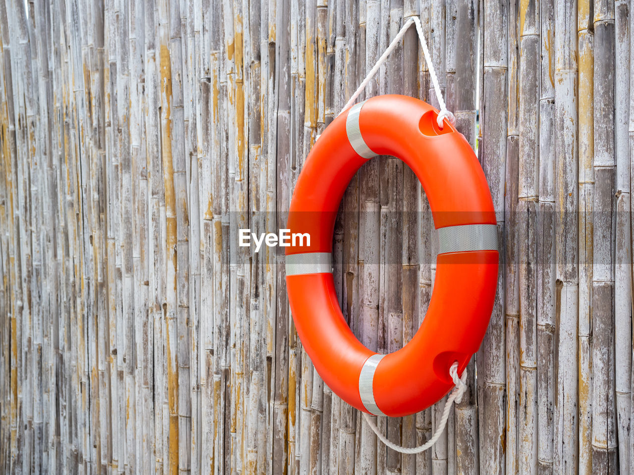 lifebuoy, life belt, wood, protection, security, red, no people, circle, orange color, number, geometric shape, buoy, hanging, day, shape, rope, tubing, wall - building feature, outdoors, orange, close-up, rescue