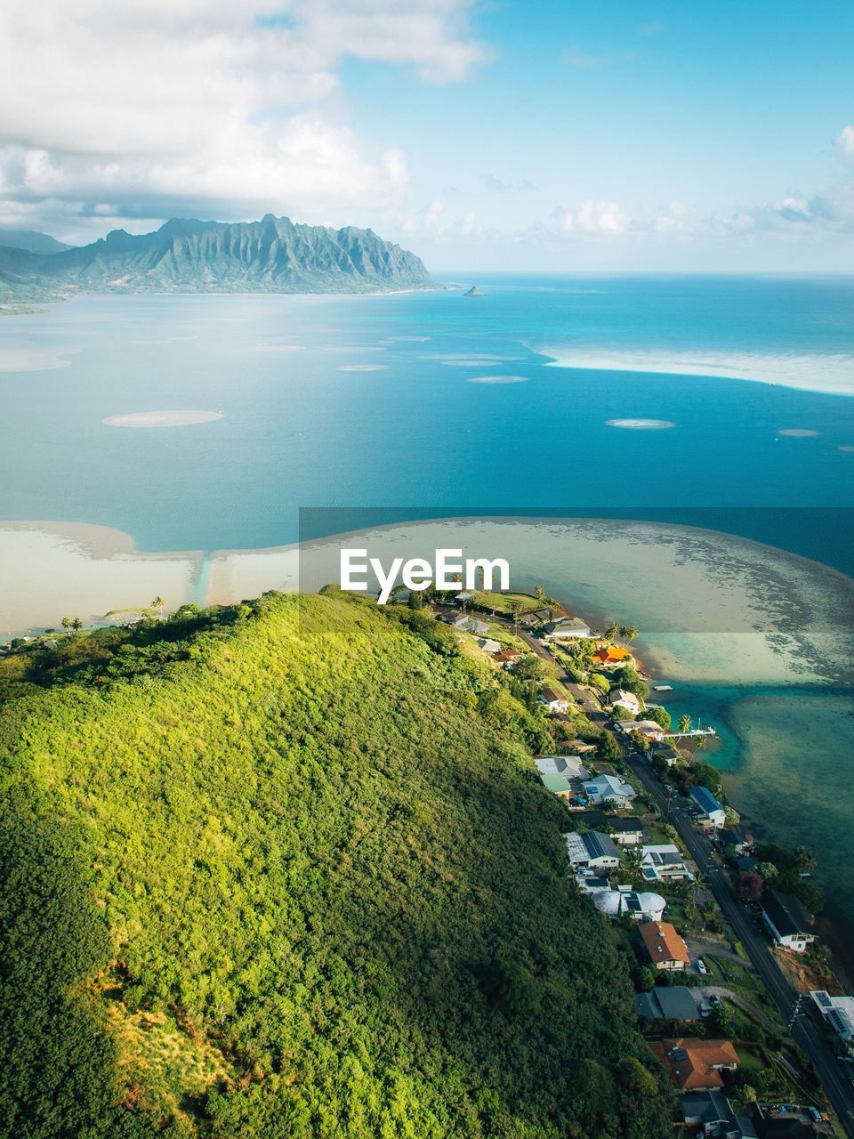 Aerial view of mountain by sea