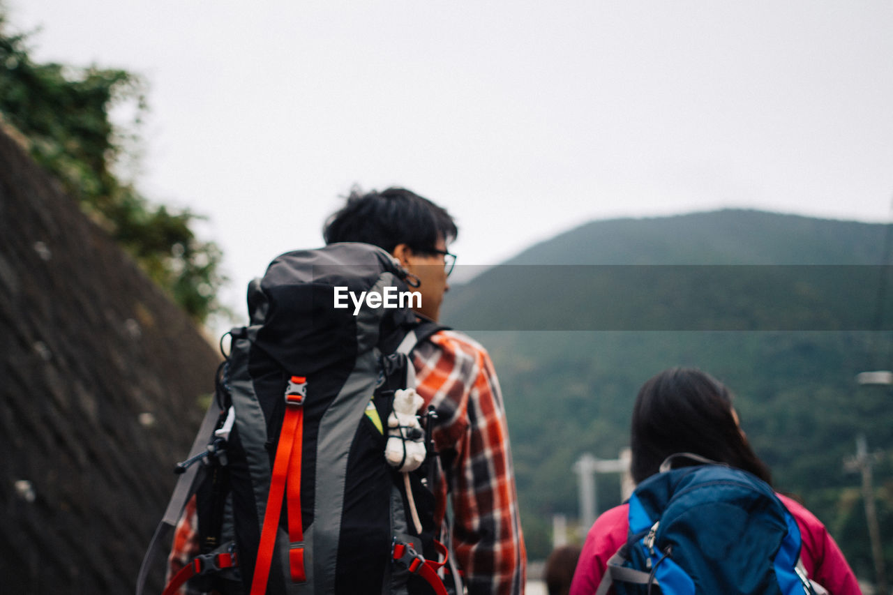 Rear view of hikers by mountains at fuji-hakone-izu national park