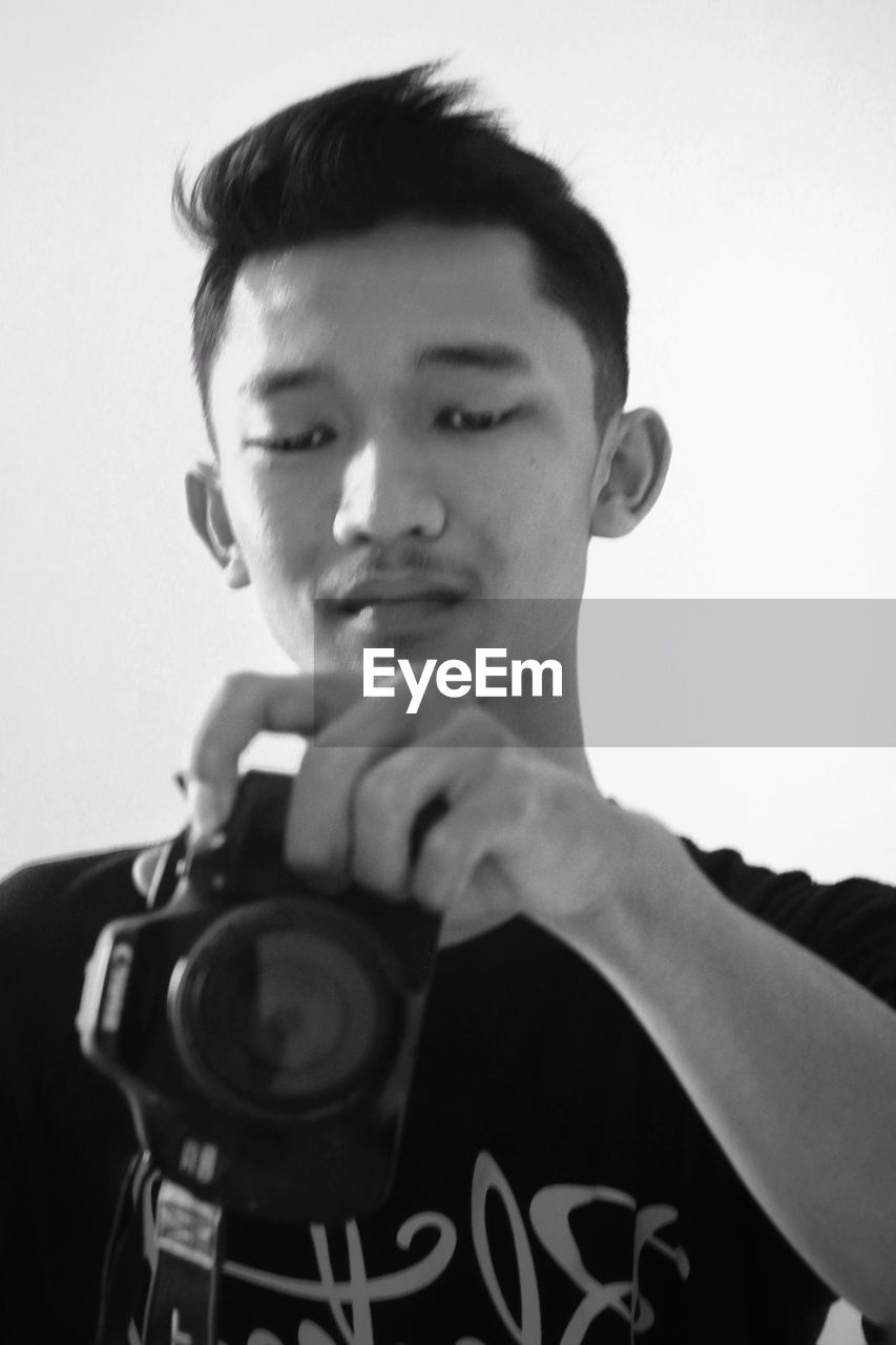 PORTRAIT OF YOUNG MAN WITH TEXT