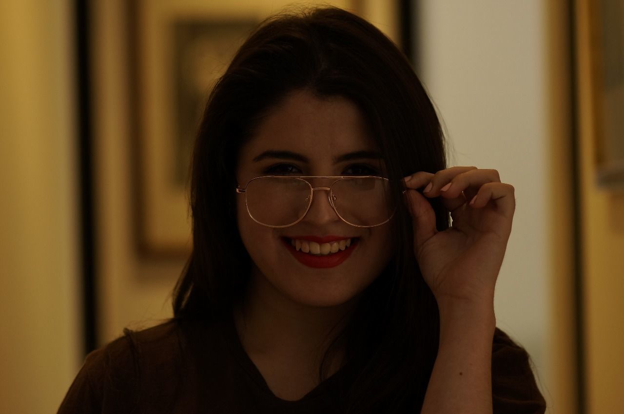 Portrait of happy woman wearing eyeglasses
