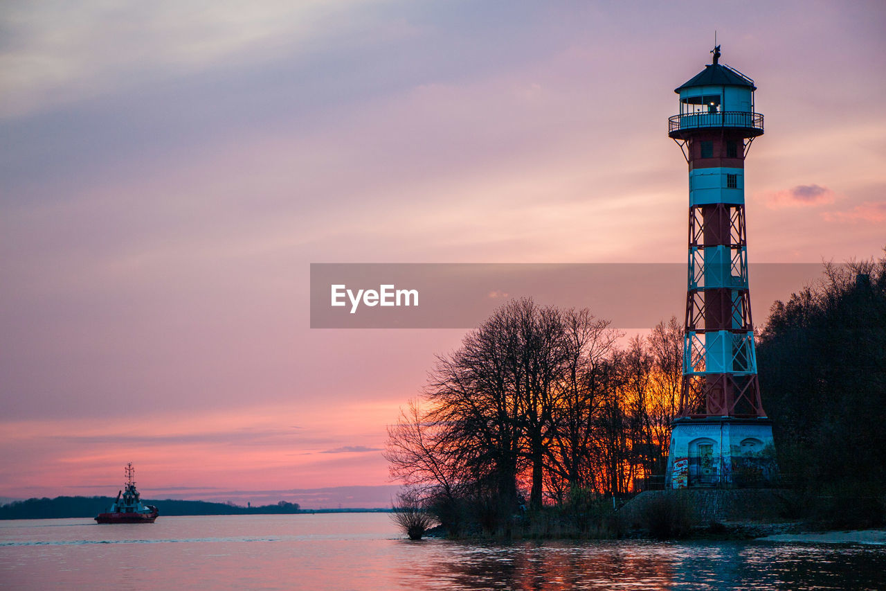 LIGHTHOUSE AGAINST SKY DURING SUNSET