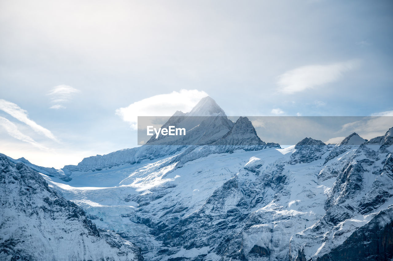 Scenic view of snowcapped mountains against sky