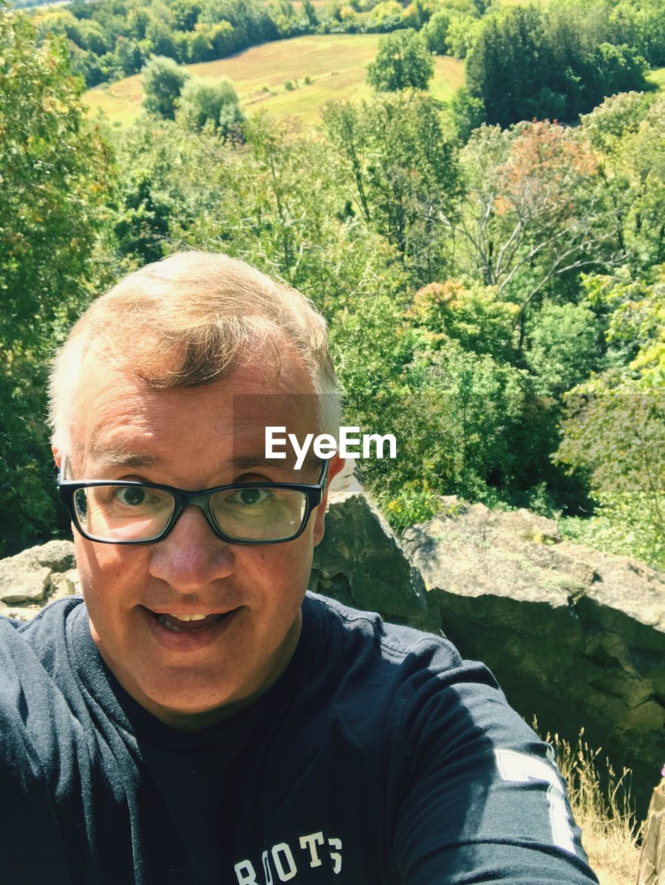 Portrait of man against trees