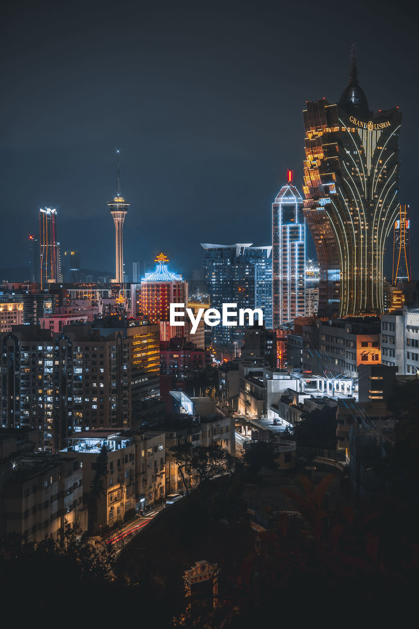 Illuminated buildings in city at night