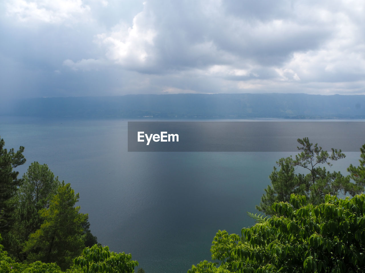 Scenic view of lake toba against sky