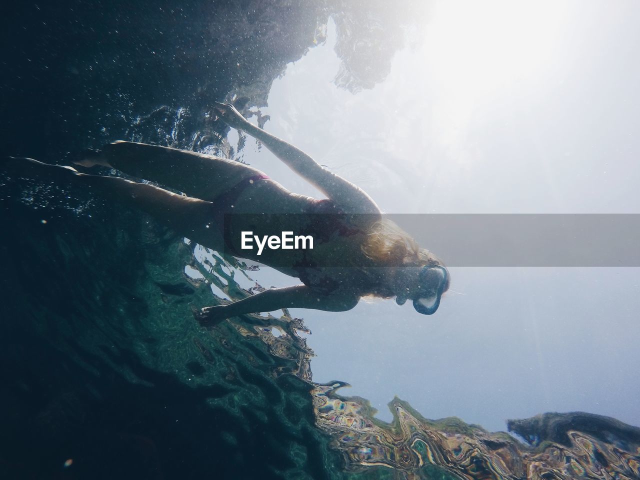 Woman swimming in sea