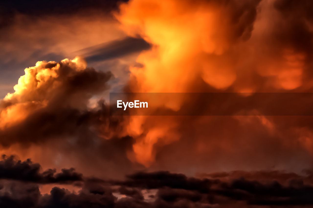 cloud, sky, warning sign, dramatic sky, storm, nature, beauty in nature, environment, sign, no people, thunderstorm, dark, orange color, cloudscape, burning, communication, power in nature, outdoors, ominous, sunset, storm cloud, night, heat, afterglow, backgrounds, fire, scenics - nature, smoke, exploding