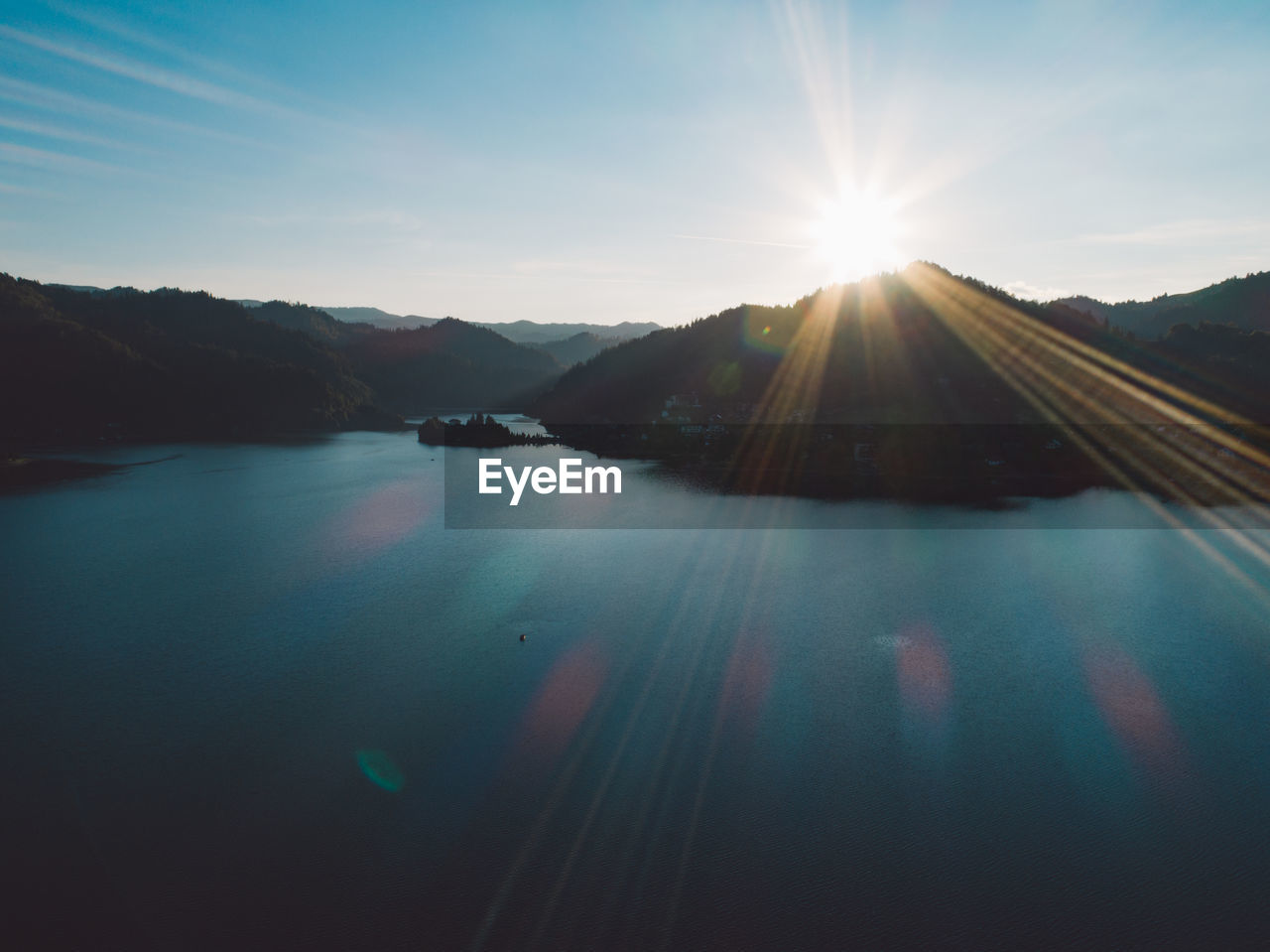 Scenic view of lake against sky during sunset