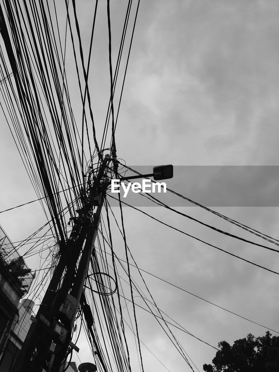 sky, black and white, monochrome photography, cloud, monochrome, cable, line, low angle view, nature, architecture, transportation, no people, vehicle, mast, electricity, sailboat, pole, built structure, mode of transportation, outdoors, city, ship, overhead power line, complexity, day, technology, black, rope, nautical vessel