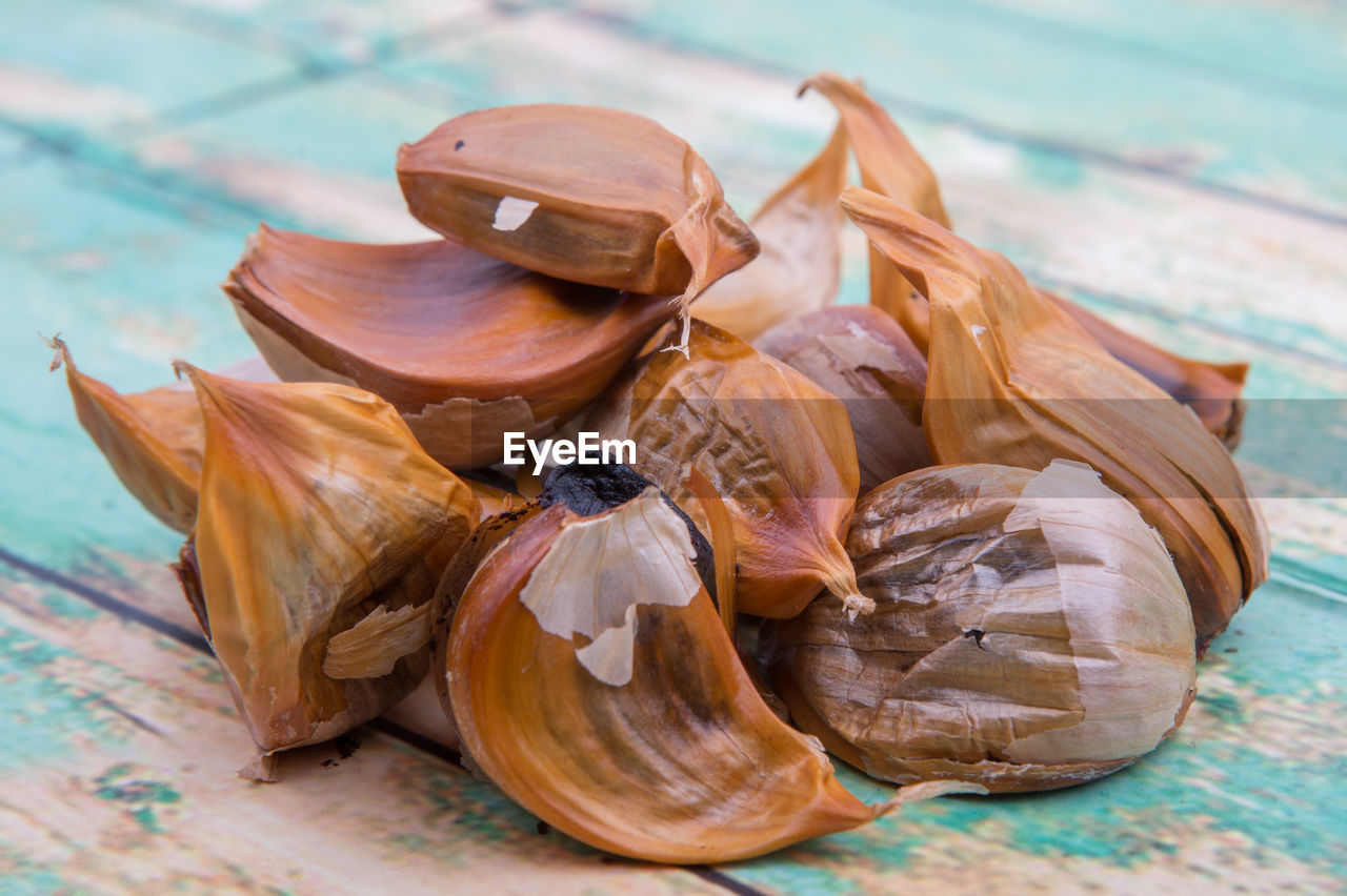 Close-up of caramelized black garlic on table