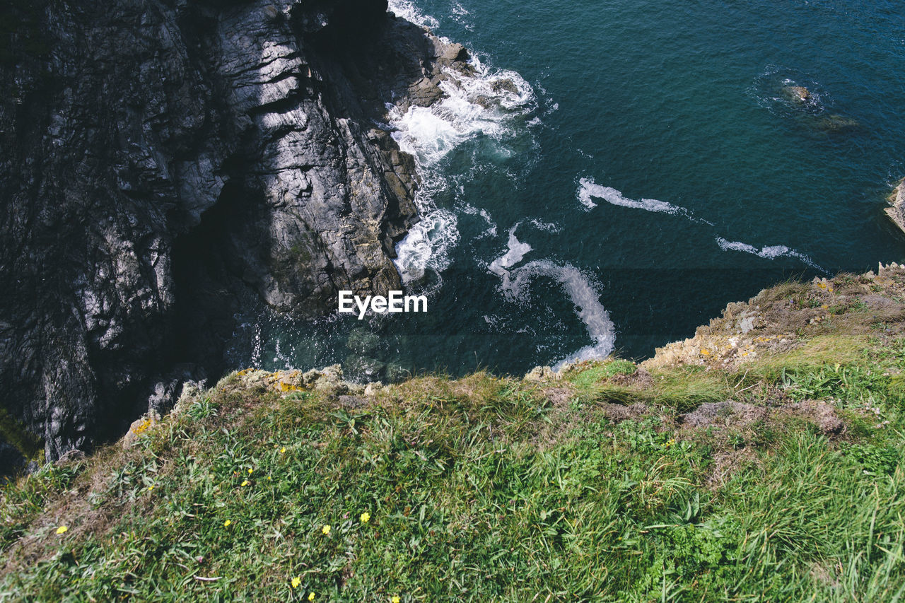 High angle view of sea by rock formation