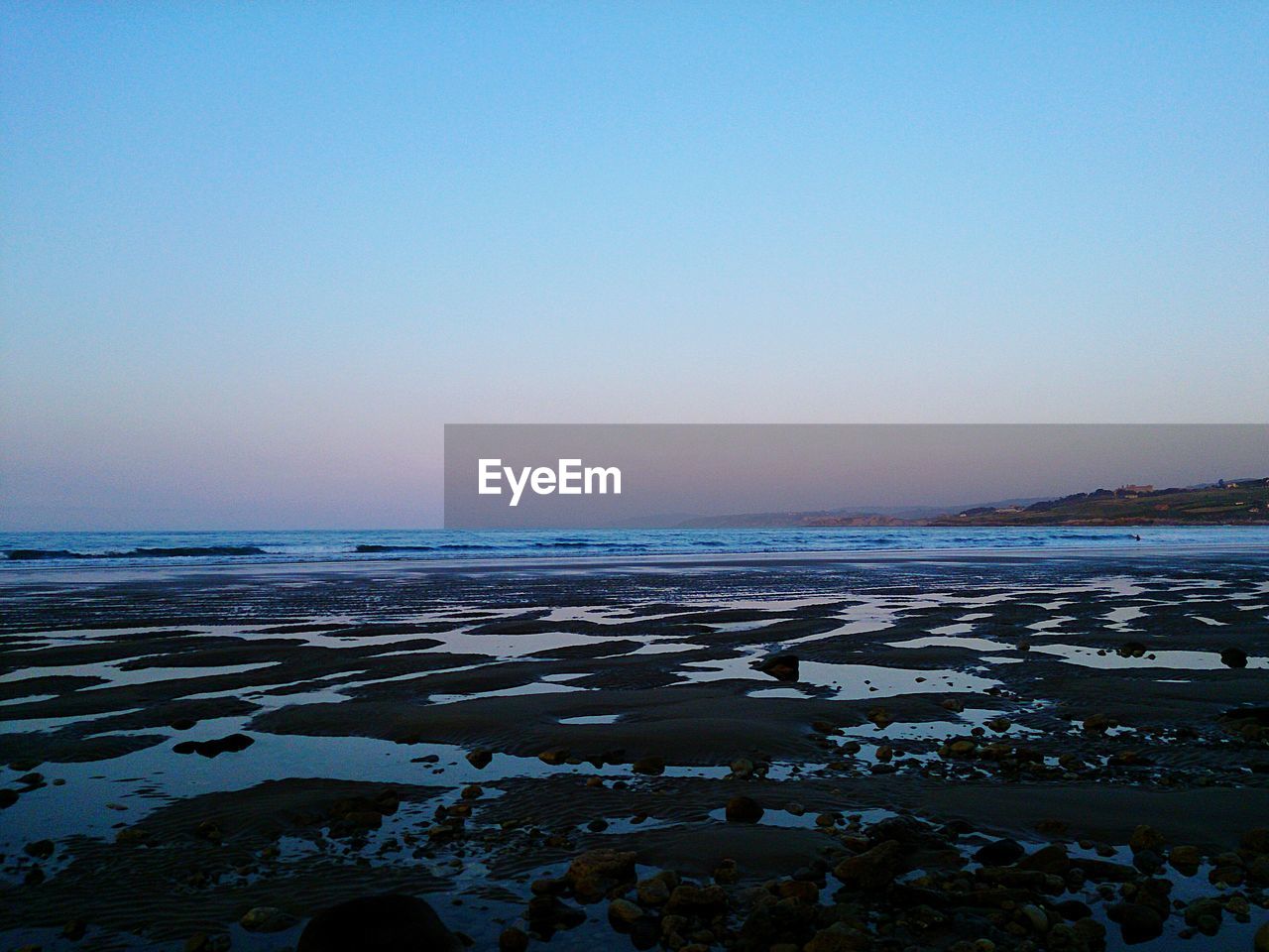 View of calm blue sea against clear sky