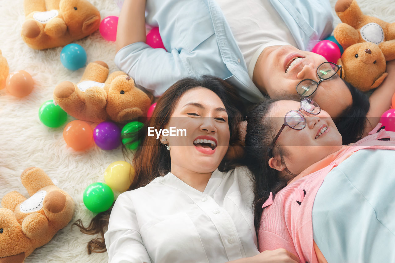 High angle view of woman with toy toys