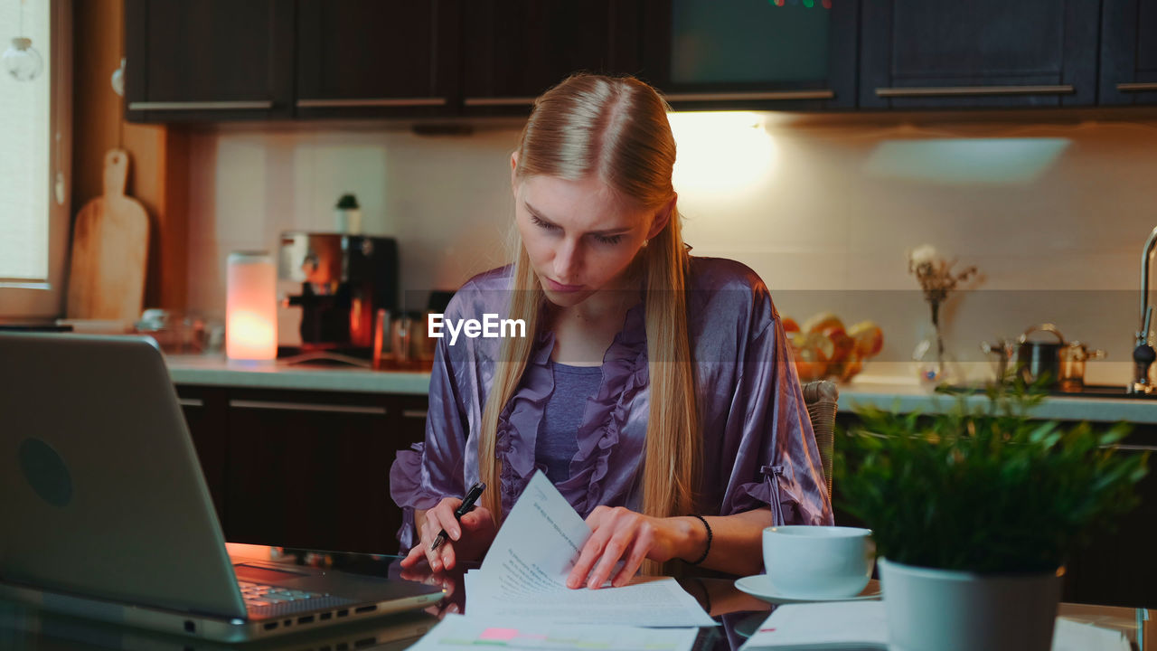 Young woman working at home