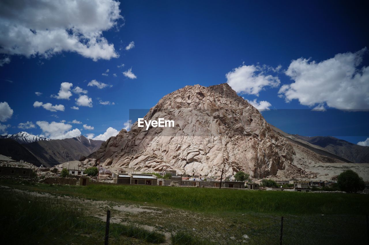 SCENIC VIEW OF MOUNTAINS AGAINST BLUE SKY