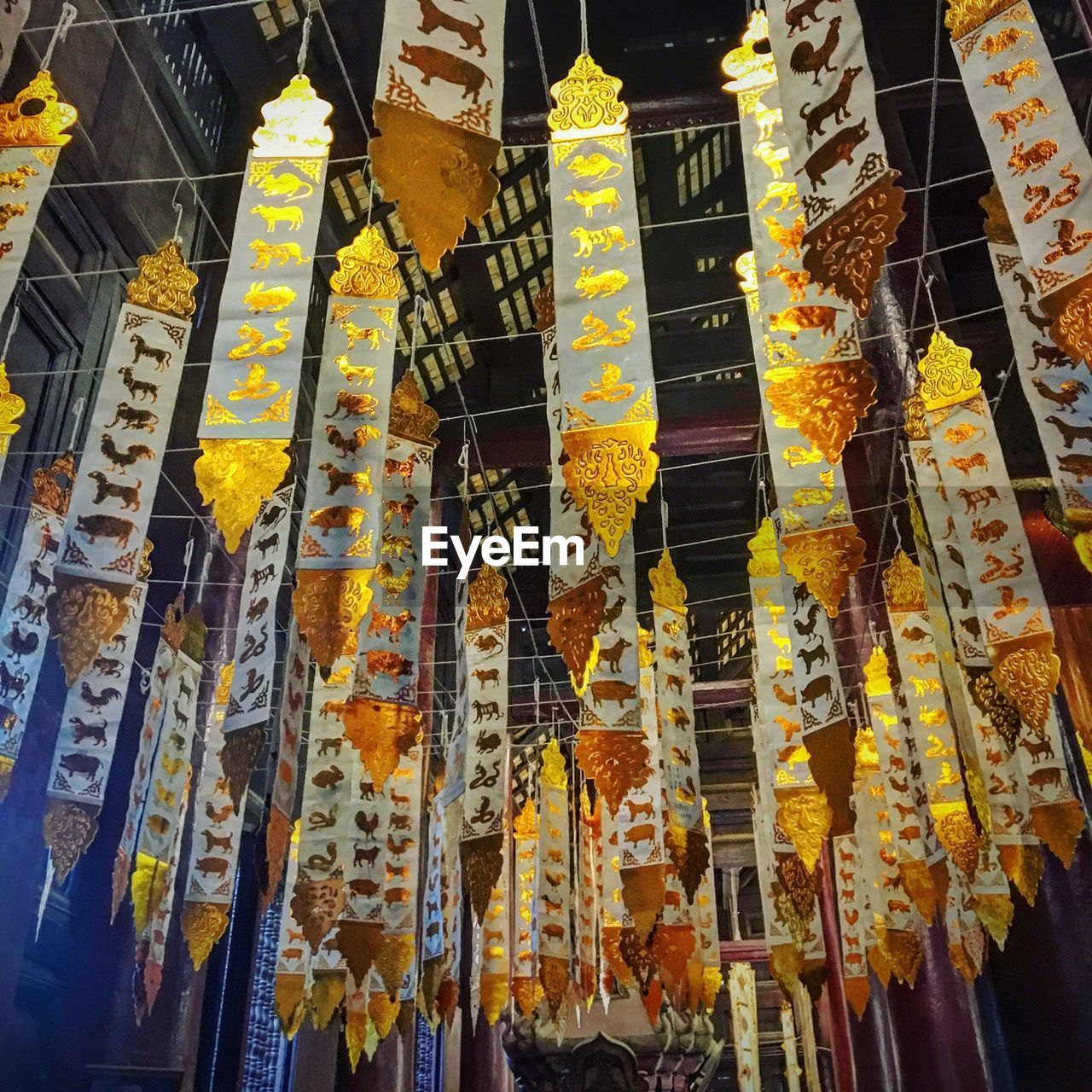 LOW ANGLE VIEW OF LANTERNS HANGING IN MARKET