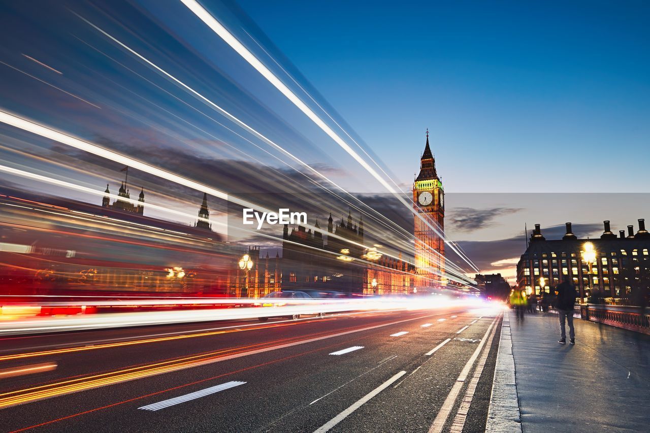 Light trails on road in london city at night