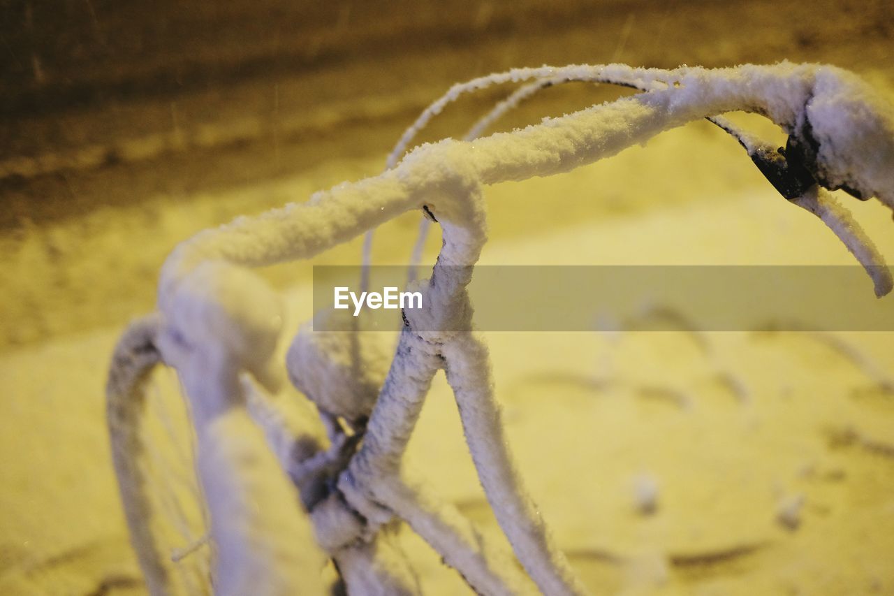 Close-up of snowed bicycle handlebar