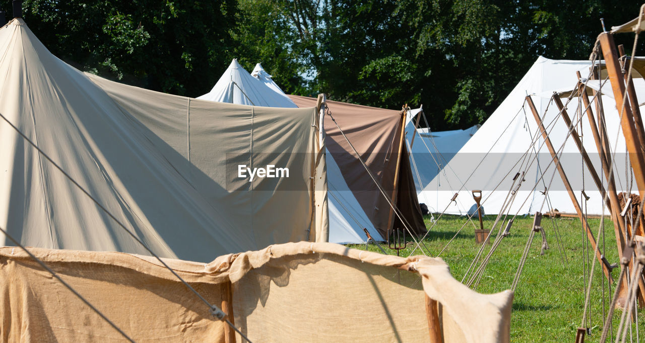 CLOTHES DRYING ON FIELD BY TENT