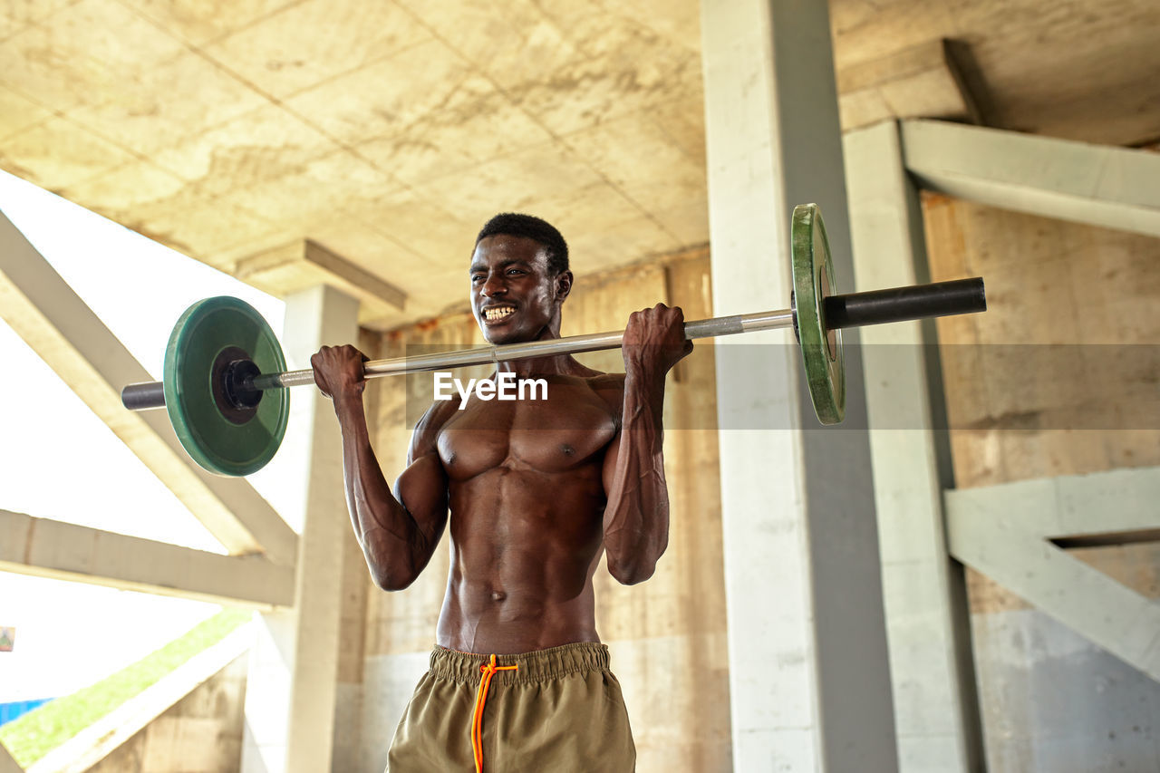 low angle view of man standing in gym