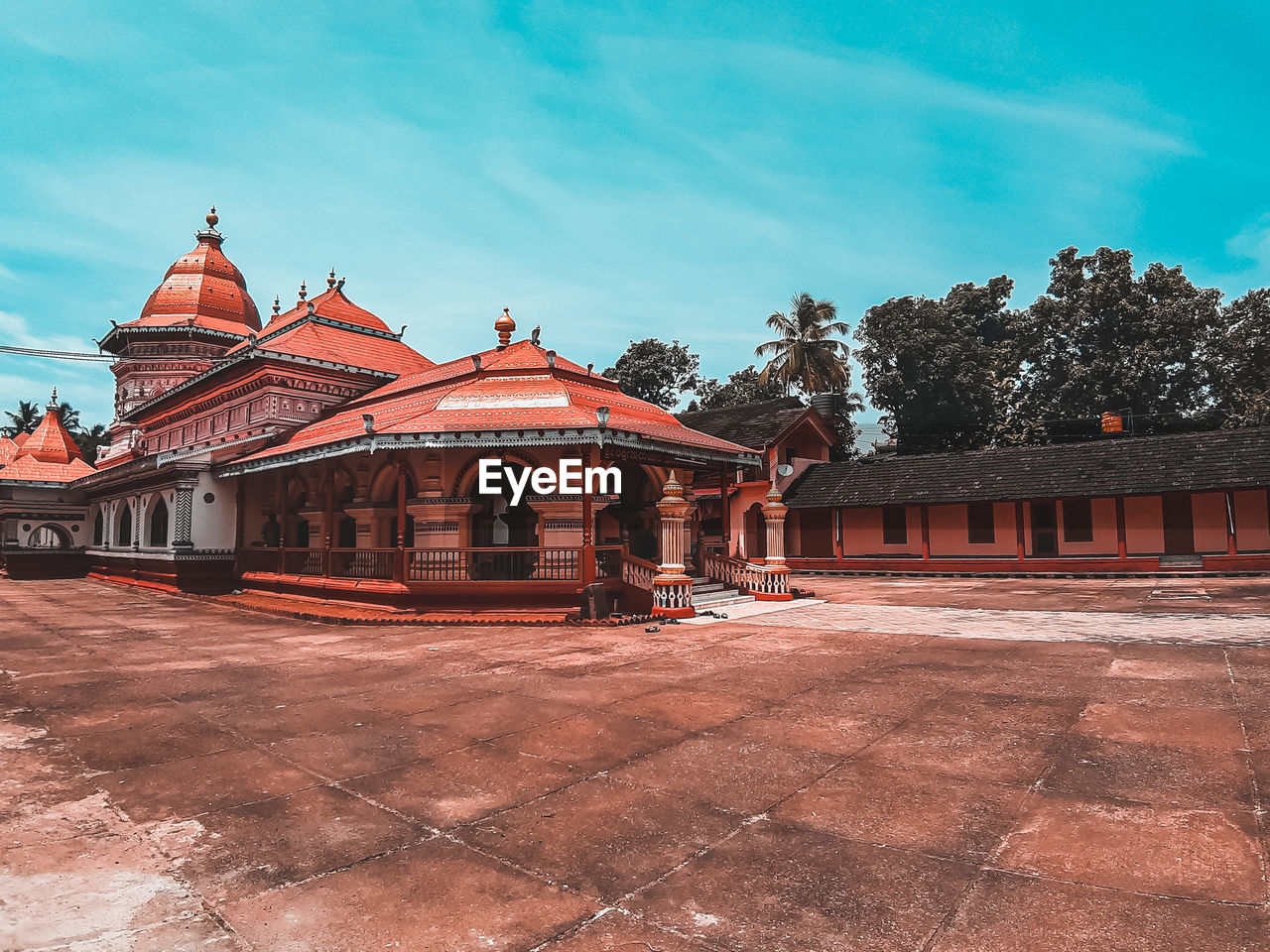 EXTERIOR OF TEMPLE AGAINST BUILDING