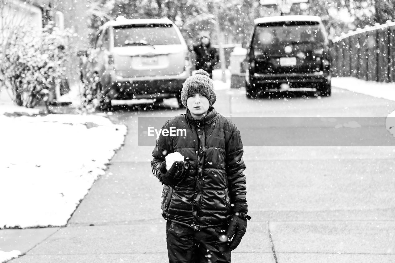 PORTRAIT OF PERSON IN SNOW