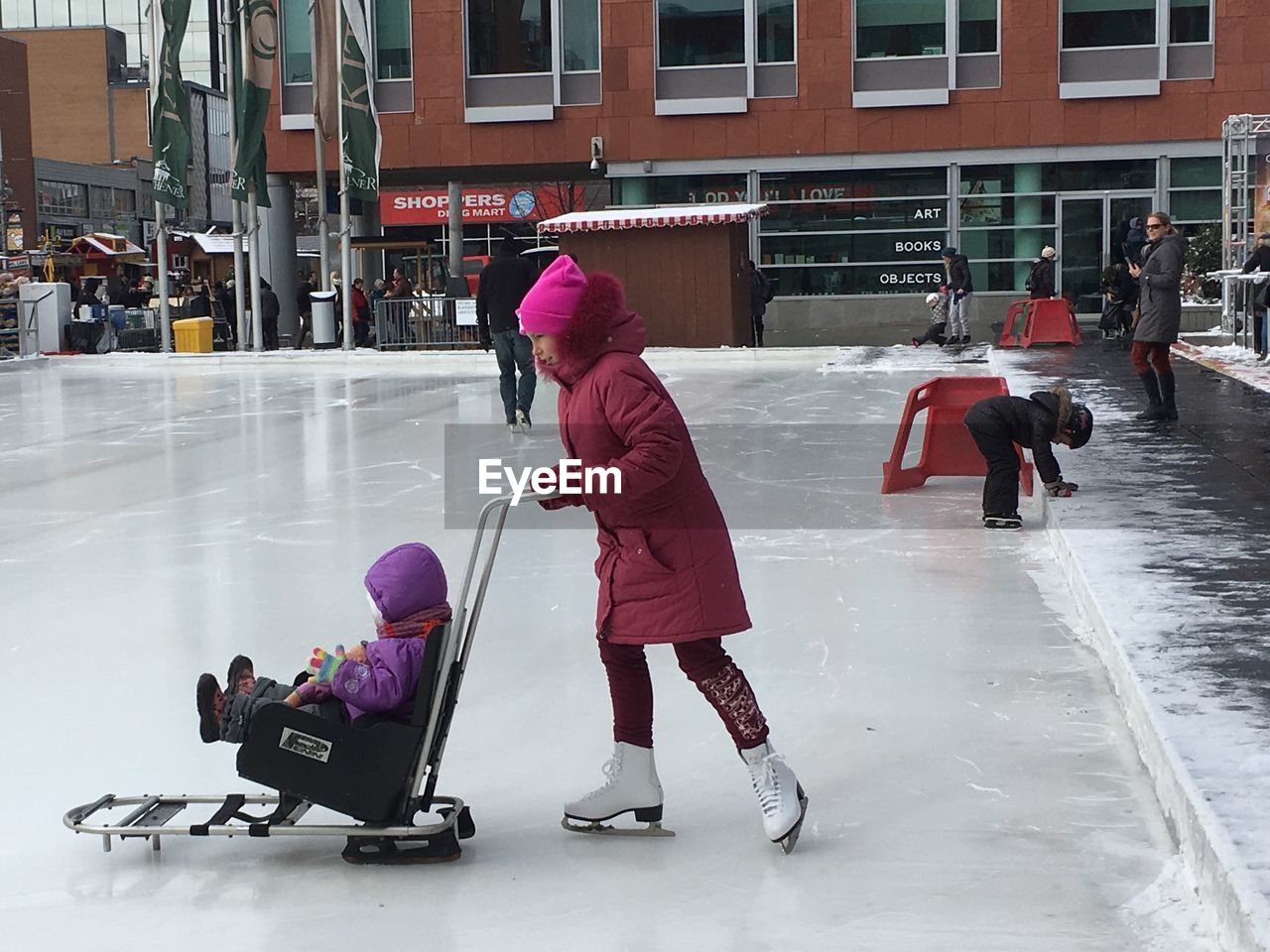 PEOPLE IN SNOW COVERED CITY