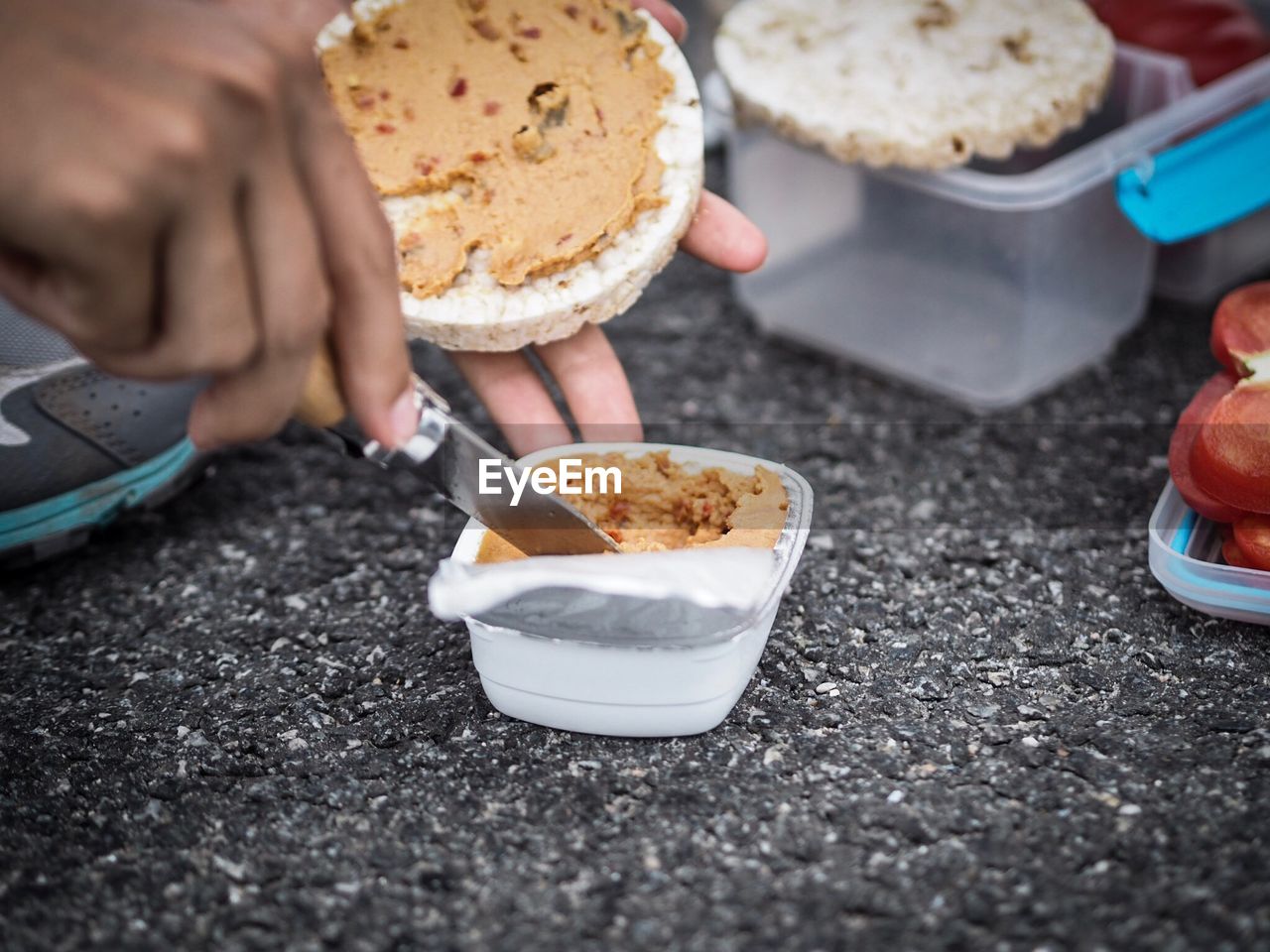 Close-up of hand holding ice cream