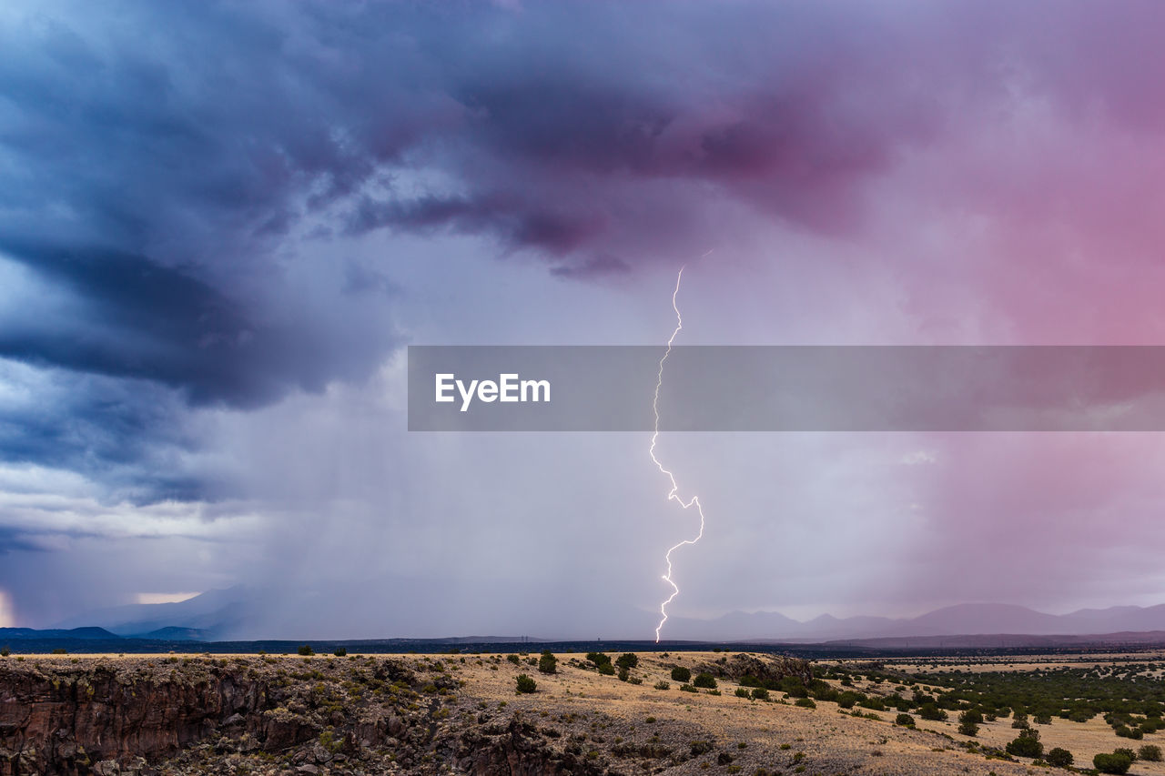 Lightning in sky over land