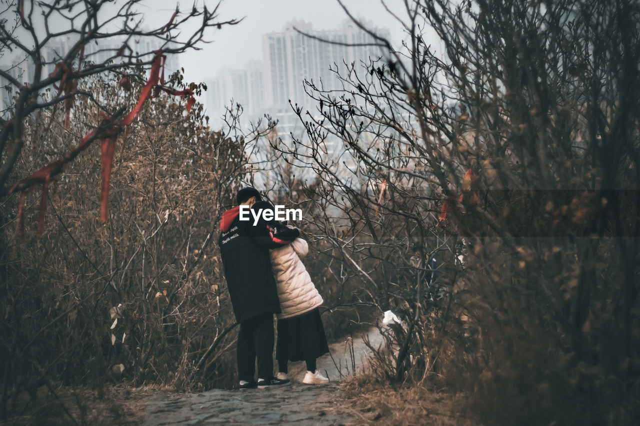 PEOPLE PHOTOGRAPHING IN FOREST