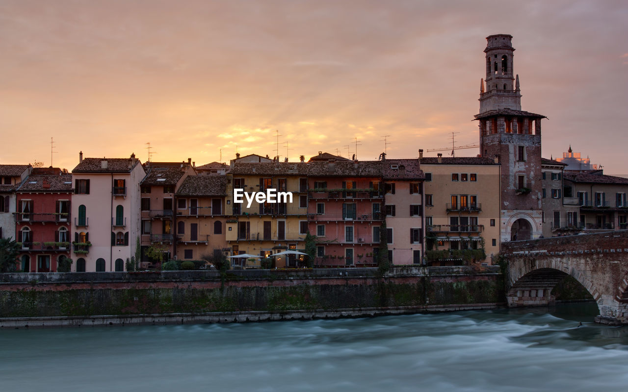 View of verona waterfront at sunset