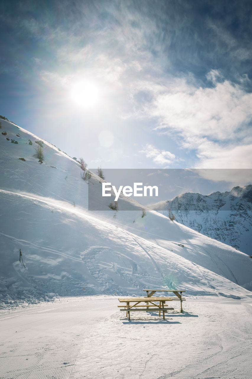 Scenic view of snow covered mountain against sky