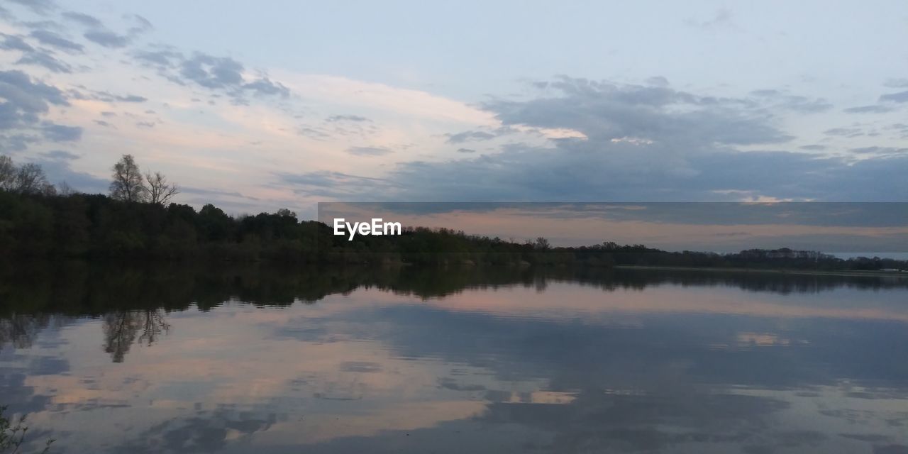 SCENIC VIEW OF LAKE BY TREES AGAINST SKY