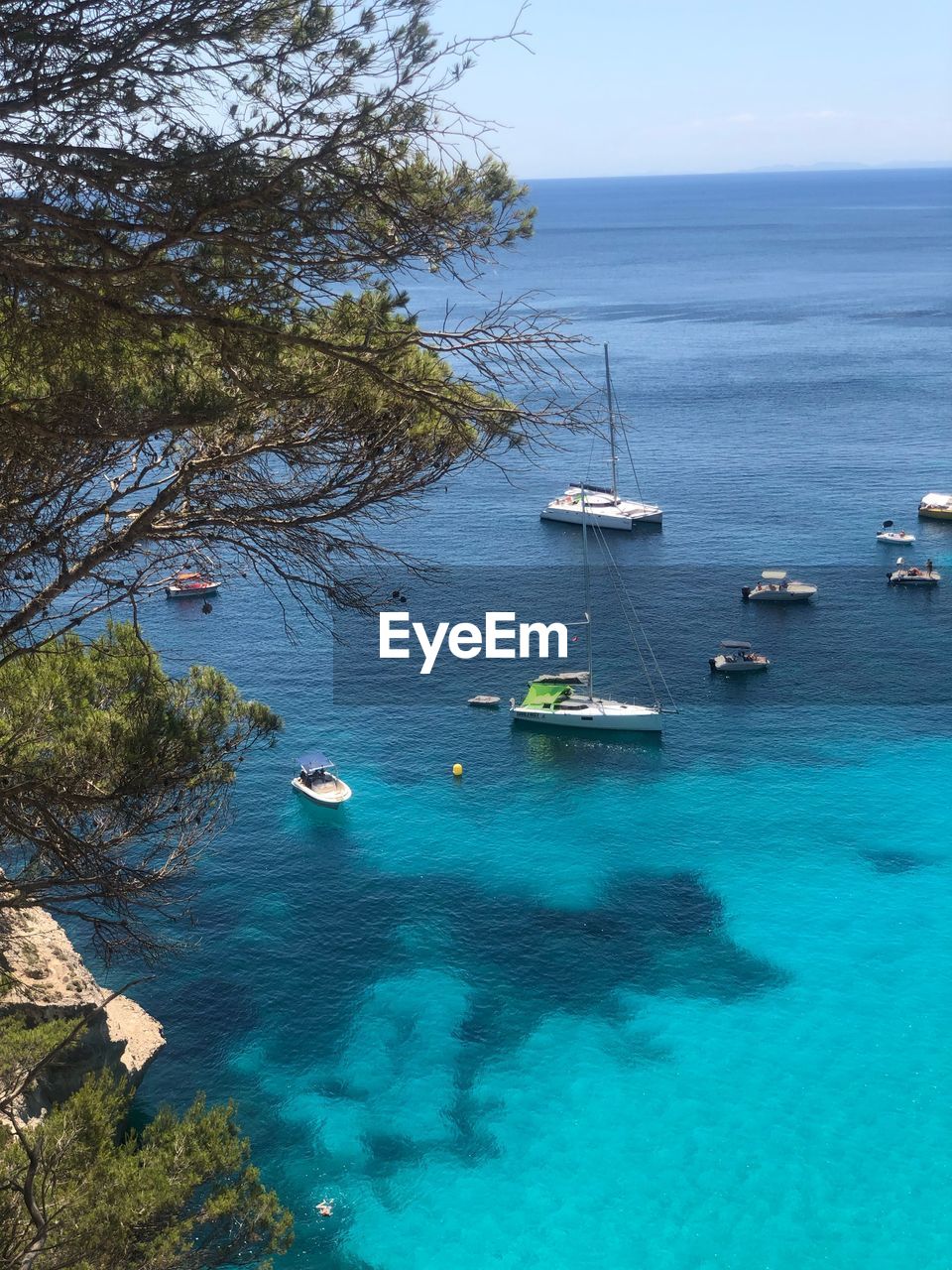 High angle view of sailboats in sea against sky