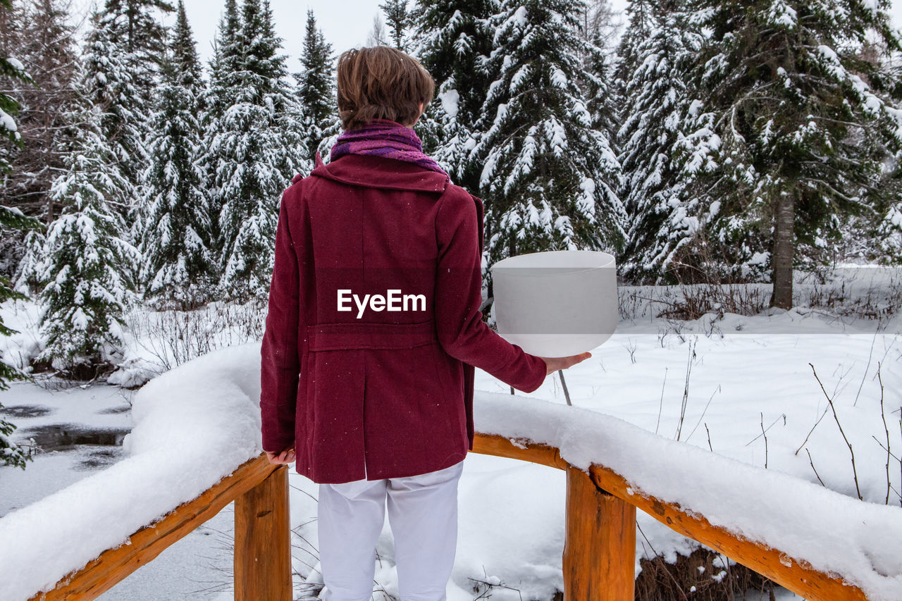 REAR VIEW OF CHILD IN SNOW